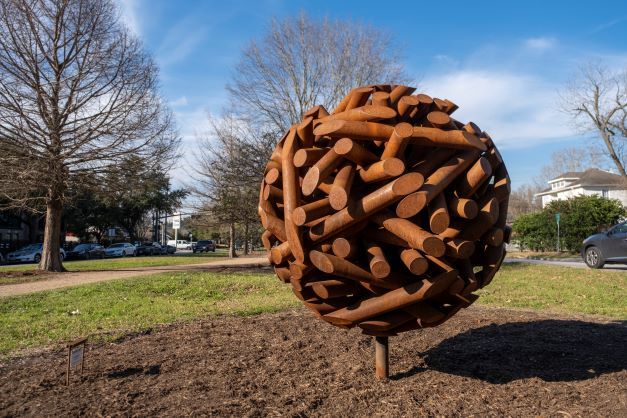 TRUE NORTH 2022 sculpture "Sphericity," a large round ball composed of brown rods