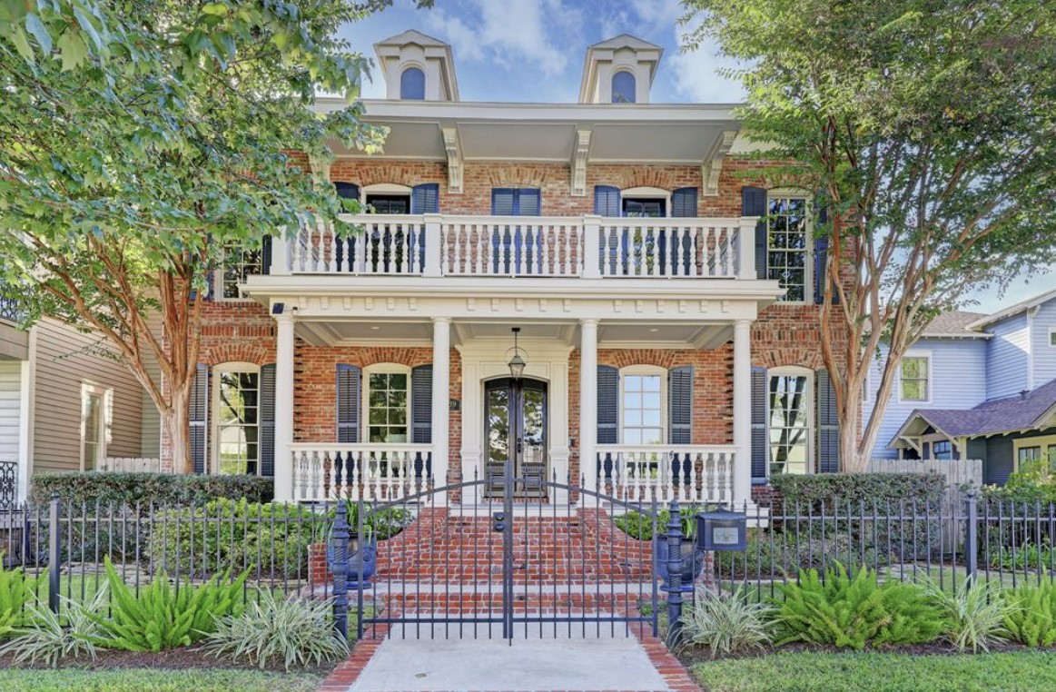 1639 Arlington Street, a large home with a brick facade and walkway and double-front porches.