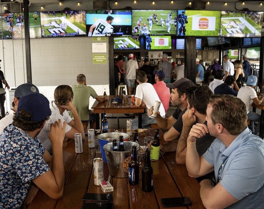 McIntyre's Heights interior featuring patrons watching sports on TVs