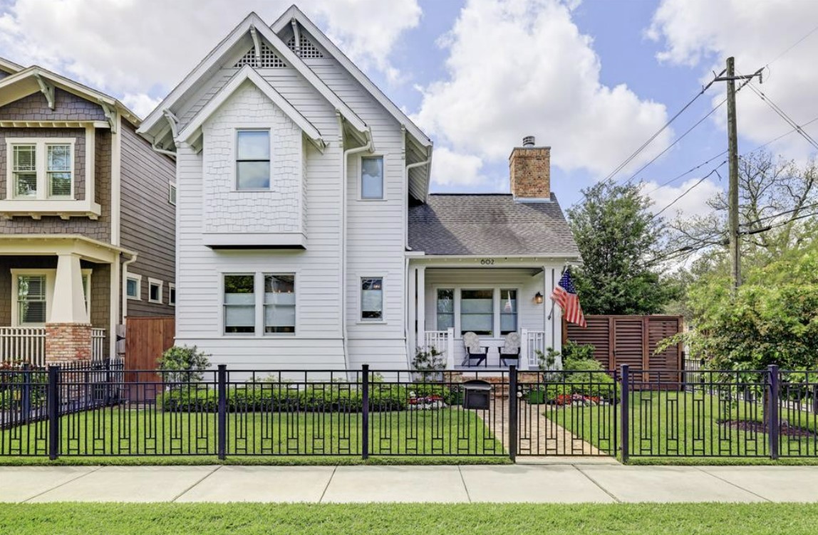 beautifully fenced two-story home